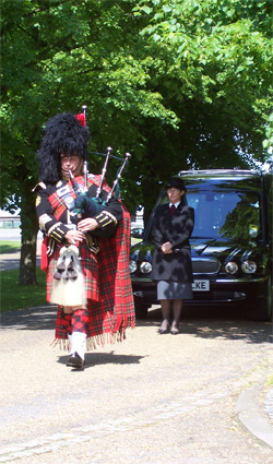 Roy playing the bagpipes at an event
