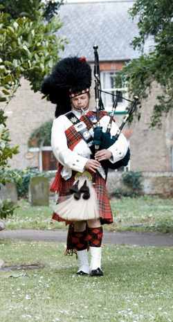Roy playing the bagpipes at an event