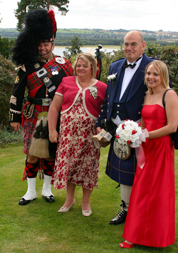 Roy playing the bagpipes at an event