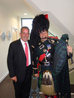 Roy playing the bagpipes at an event