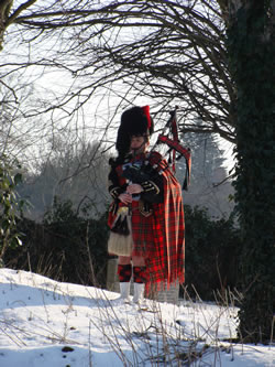 Roy playing the bagpipes at an event