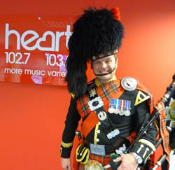 Roy playing the bagpipes at an event