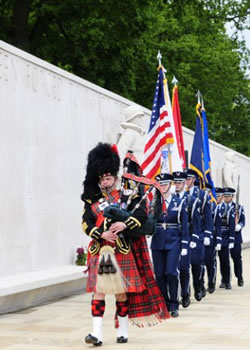 Roy playing the bagpipes at an event