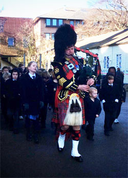 Roy playing the bagpipes at an event