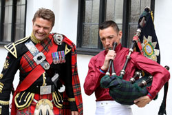 Roy playing the bagpipes at an event