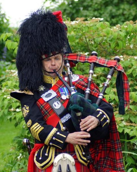 Roy playing the bagpipes at an event