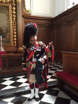 Roy playing the bagpipes at an event