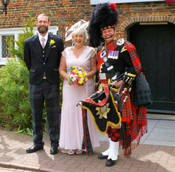 Roy playing the bagpipes at an event