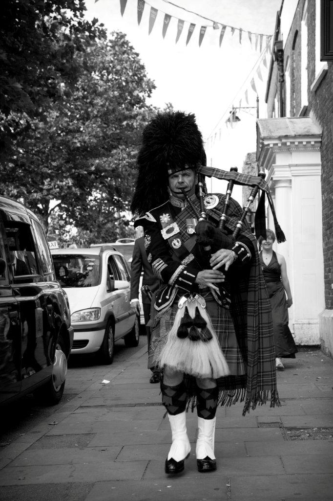 Roy playing the bagpipes at an event